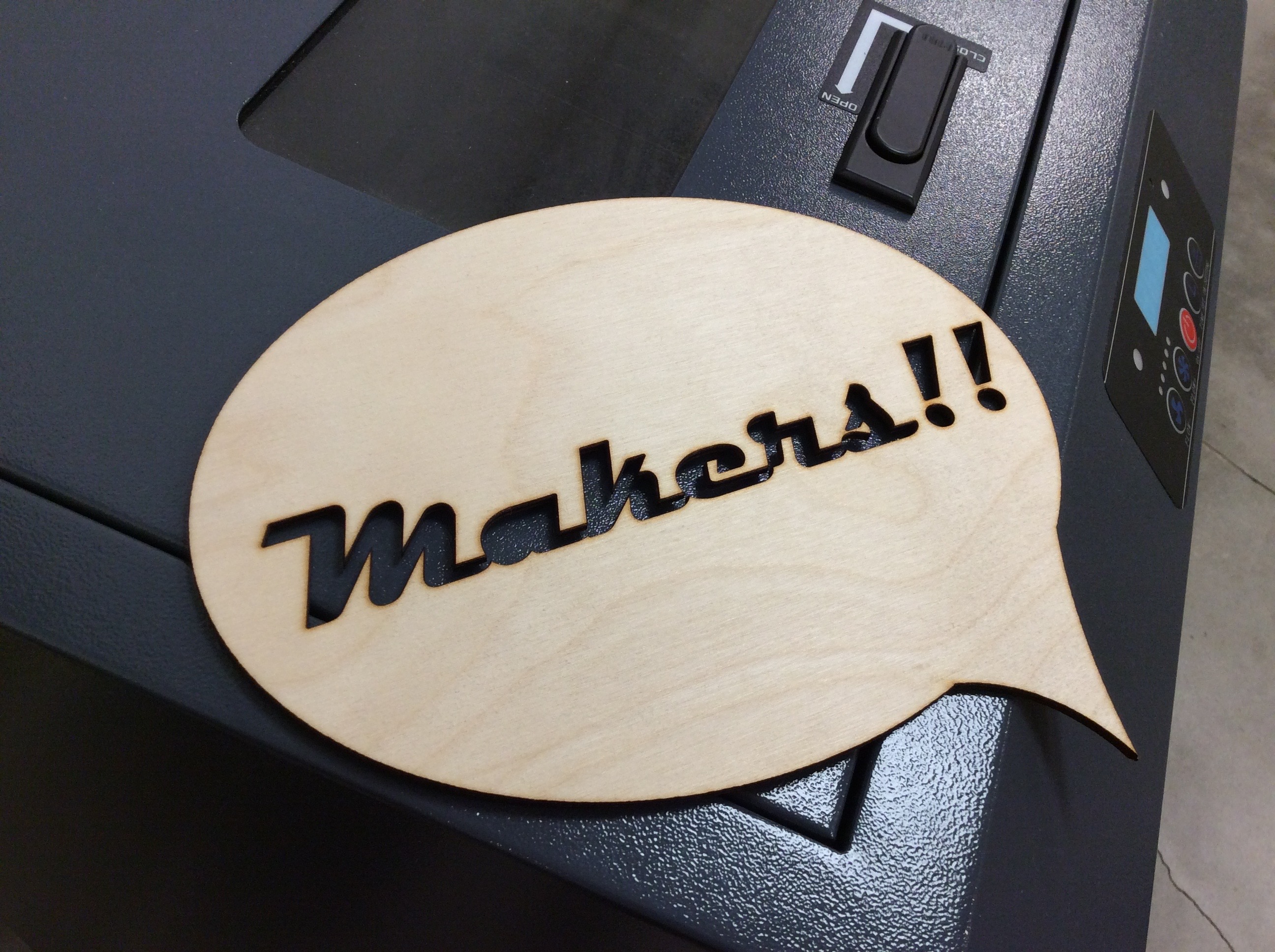 A piece of wood that says "Makers!!"